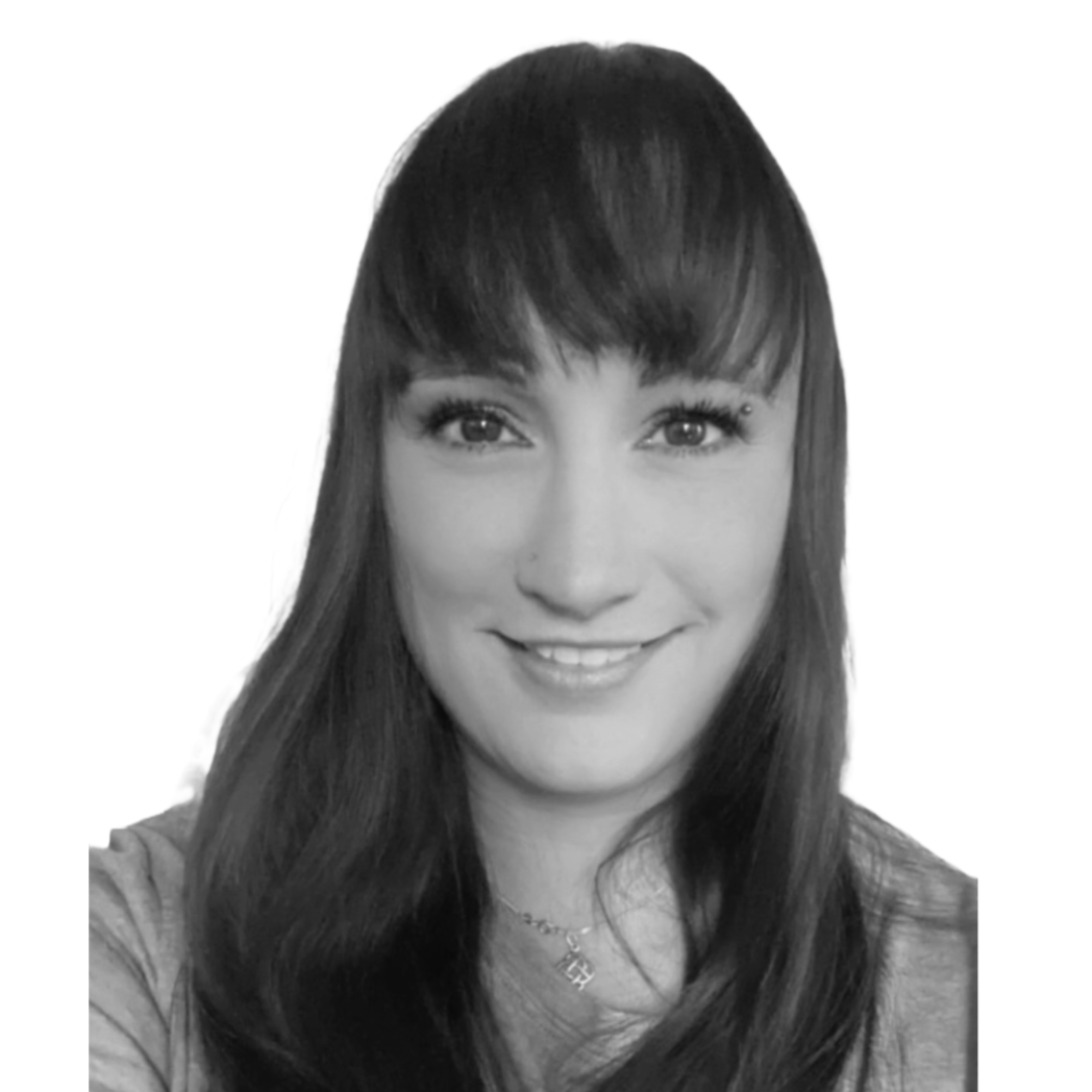 Author head shot Head shot photo of the author, smiling wearing black headphones. Caucasian female with dark purple hair. She looks friendly.