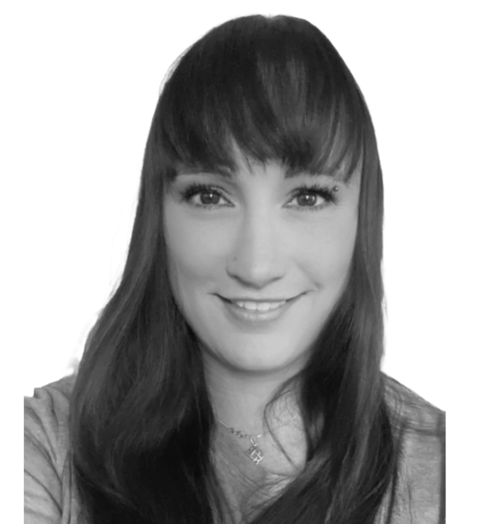 Picture is a black and whie head shot of the author. She is smiling with long hair and fringe. 