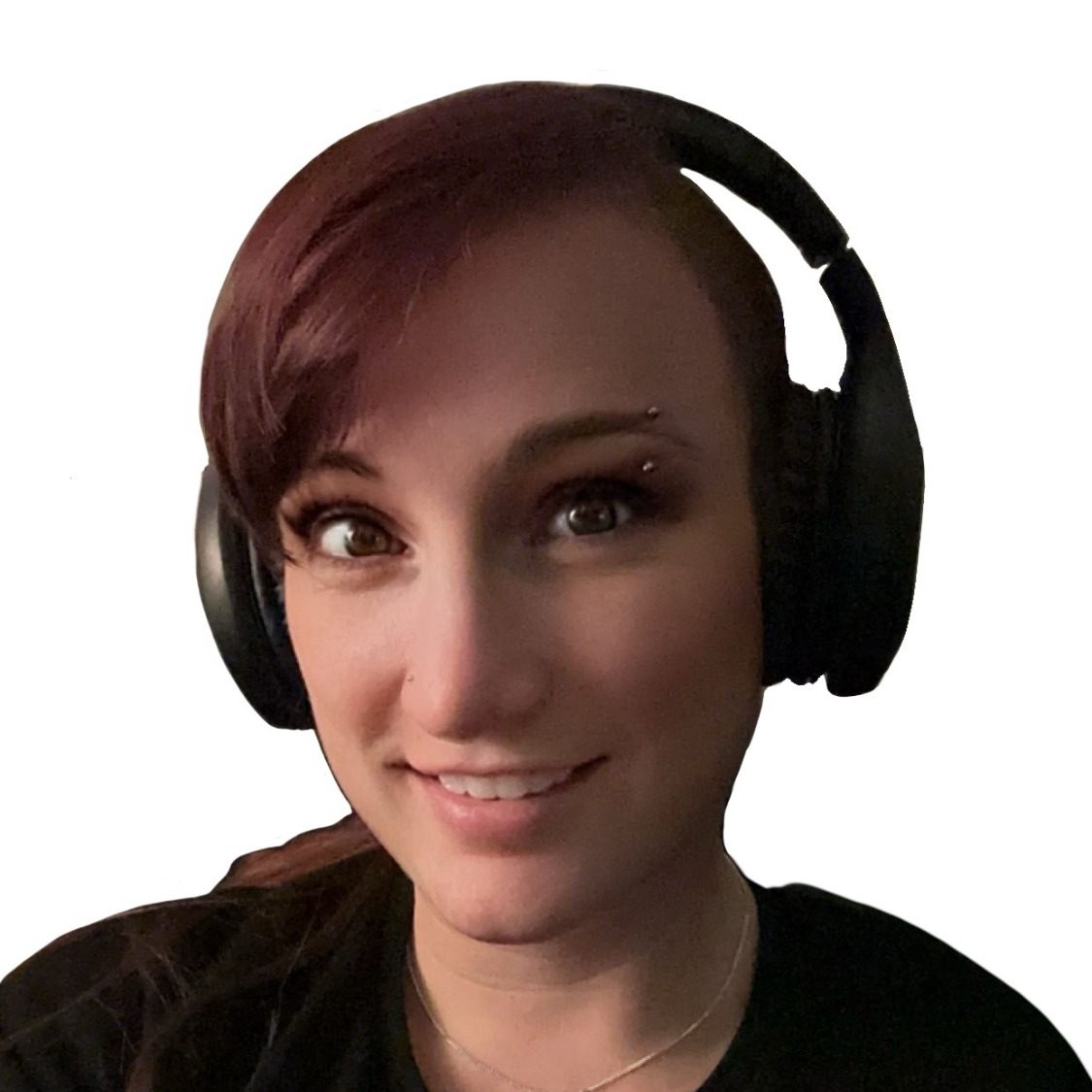 Head shot photo of the author, smiling wearing black headphones.  Caucasian female with dark purple hair. She looks friendly.